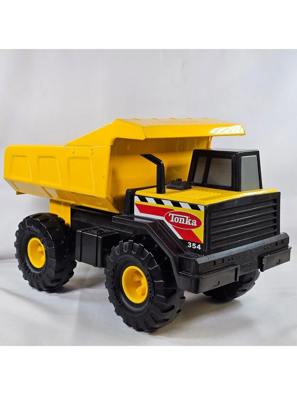 Tonka 354 Mighty Dump Truck Yellow Steel Bed Construction Toy Vehicle 17 Inch